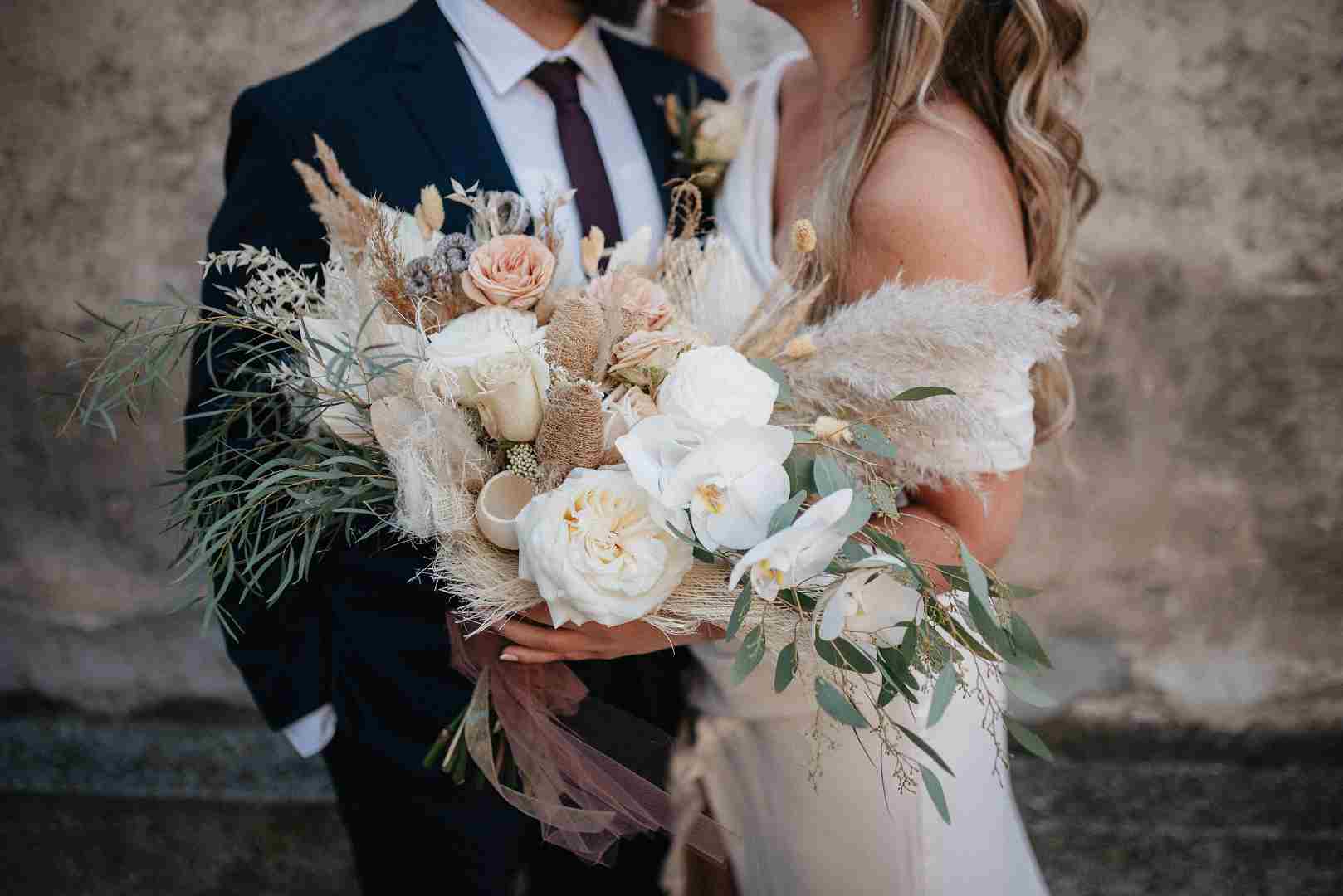 Bride and Groom with wedding bouquet photographer